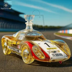 A glass Porsche race car decanter shaped like a 1960s sports car on a race track.