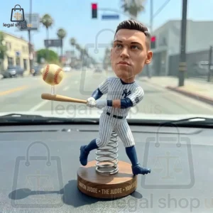 Aaron Judge baseball player bobblehead figure on a dashboard