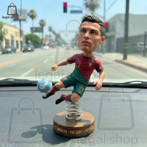 Cristiano Ronaldo bobblehead figure on a car dashboard