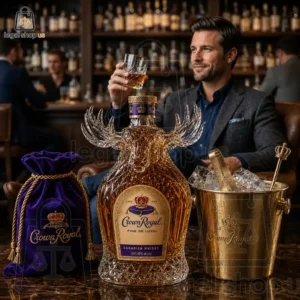 Man sitting in a lounge with a decorative Crown Royal Canadian Whisky bottle, a purple velvet pouch, and an ice bucket.