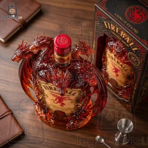 A highly detailed dragon-themed Fireball Cinnamon Whisky bottle and box set on a wooden surface.