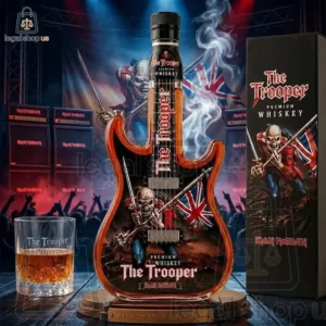 2026 Iron Maidens The Trooper Guitar Whiskey Bottle Iron Maiden The Trooper guitar-shaped whiskey bottle with glass and packaging.
