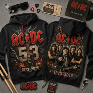 Two black AC/DC band hoodies featuring 1973-2026 anniversary artwork with band member graphics and lightning elements.