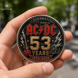 ACDC 53rd Anniversary Commemorative Challenge Coin A hand holding a commemorative AC/DC 53rd anniversary metal coin