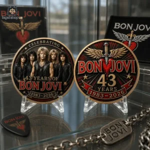 Two commemorative Bon Jovi 43rd anniversary coins displayed on stands.