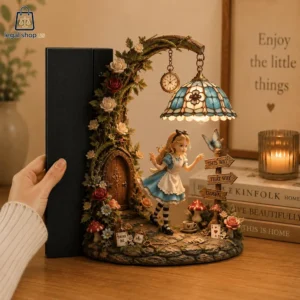 Alice In Wonderland Figurines Lamp Alice in Wonderland themed decorative lamp bookend on a wooden table.
