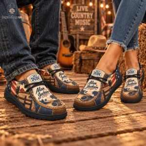 Person wearing Alan Jackson themed Hey Dude casual shoes in a rustic country setting