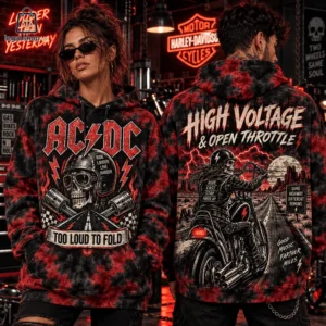 Man and woman modeling red and black tie-dye AC/DC motorcycle-themed hoodies in a garage setting.