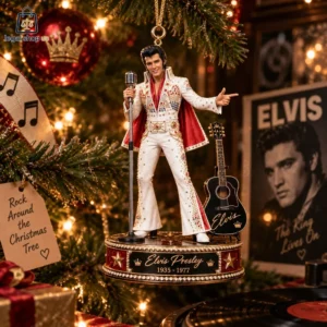 Collectible Elvis Presley commemorative Christmas tree ornament featuring him in a white jumpsuit with a microphone and guitar.