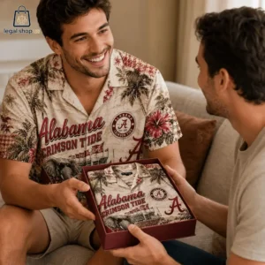 Man smiling while receiving an Alabama Crimson Tide tropical shirt as a gift