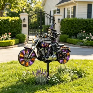 Skeleton witch riding a chopper motorcycle lawn ornament in a garden.