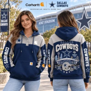 Woman modeling a Dallas Cowboys and Carhartt collaborative hoodie in front of AT&T Stadium.