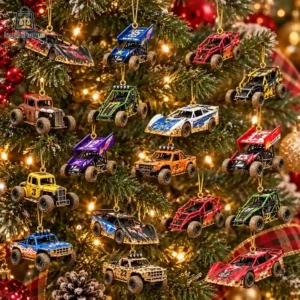 Collection of race car and off-road truck Christmas tree ornaments hanging on a pine tree.