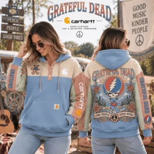 A woman modeling a Grateful Dead and Carhartt collaboration hoodie featuring a vintage-inspired design.